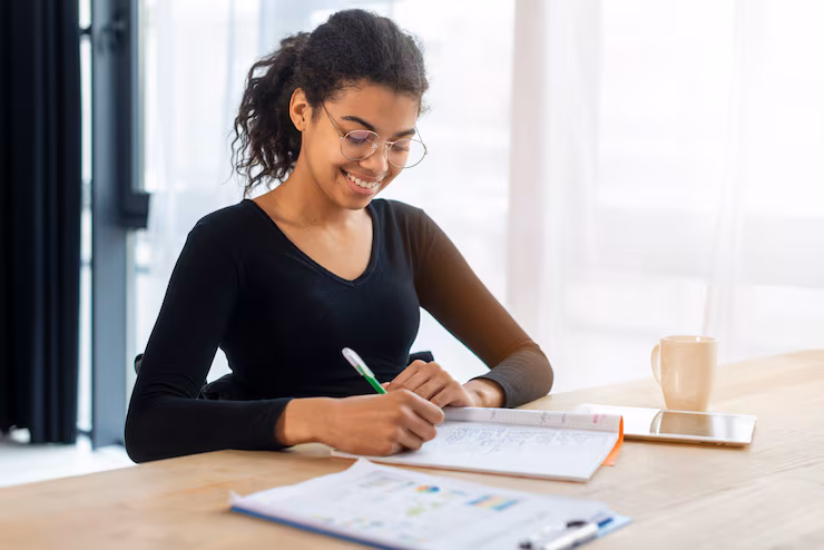 portrait-positive-young-woman-working-office_23-2148461499